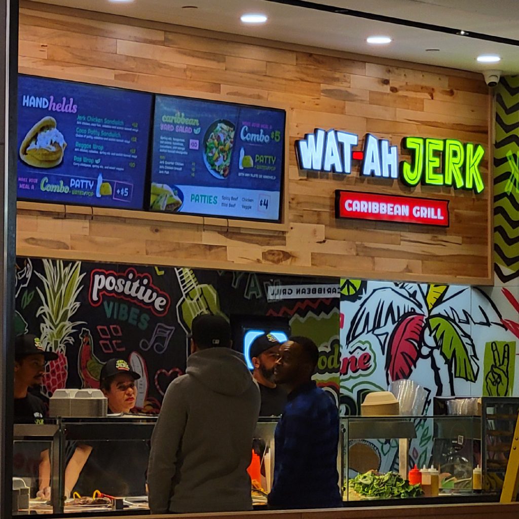 Store front image of Wat Ah Jerk Caribbean Grill Counter at the Simcoe Place Food Court